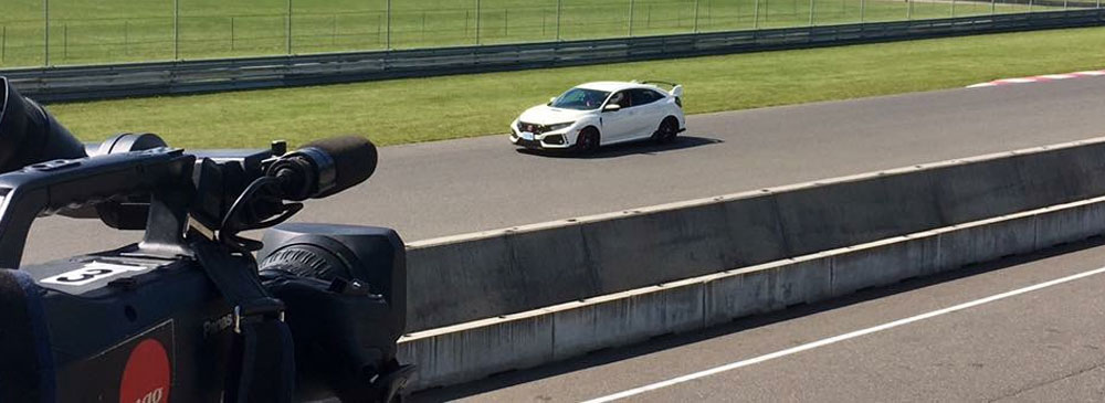 Man filming Honda Type R on racetrack